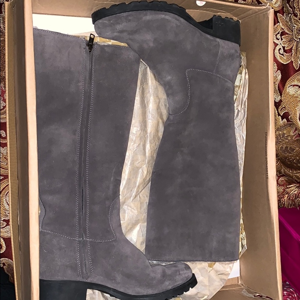 Authentic Grey UGG boots with a side zipper